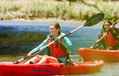 Three women kayaking