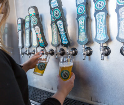 Taps being poured at Ninkasi Brewing Company in Eugene