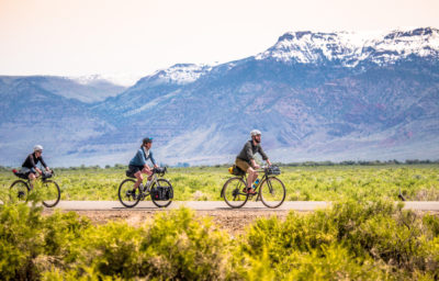 Three cyclists riding in Oregon's Outback roads