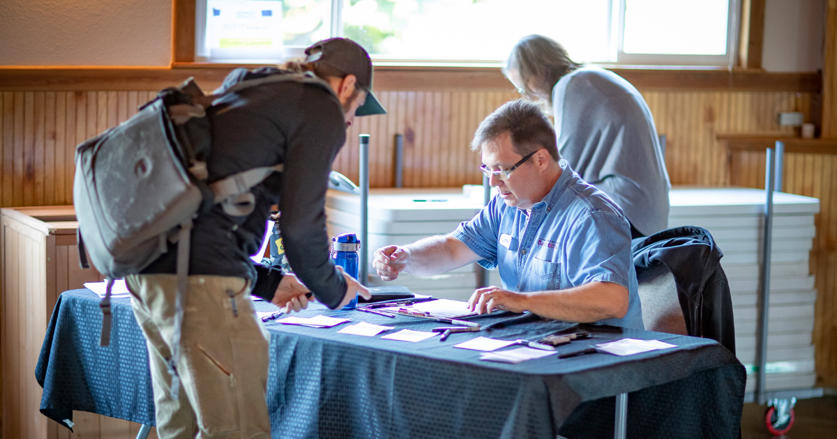 Man registering at a conference