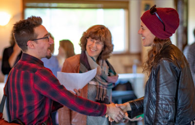 People shaking hands at a conference