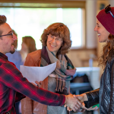 People shaking hands at a conference