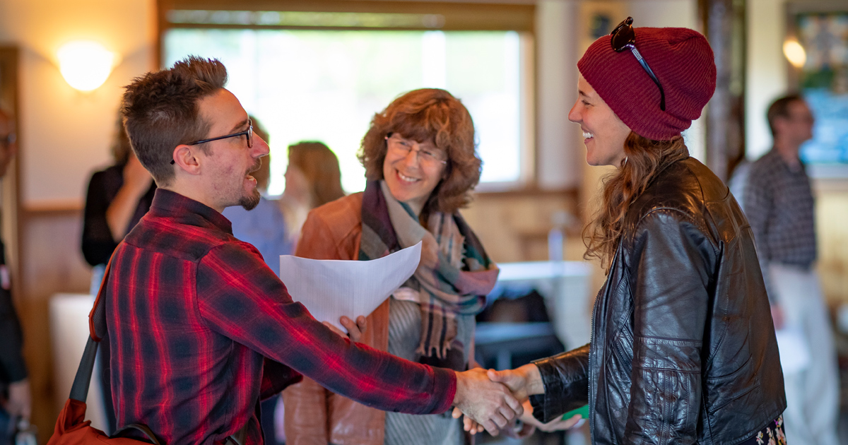 People shaking hands at a conference