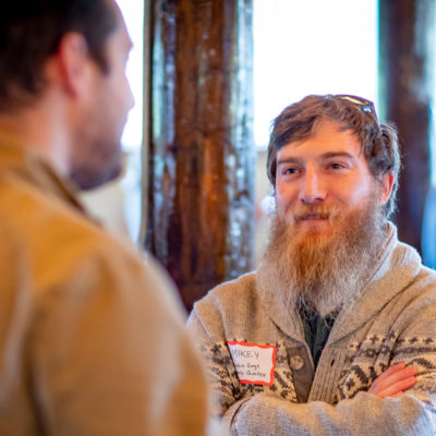 Men talking at a conference