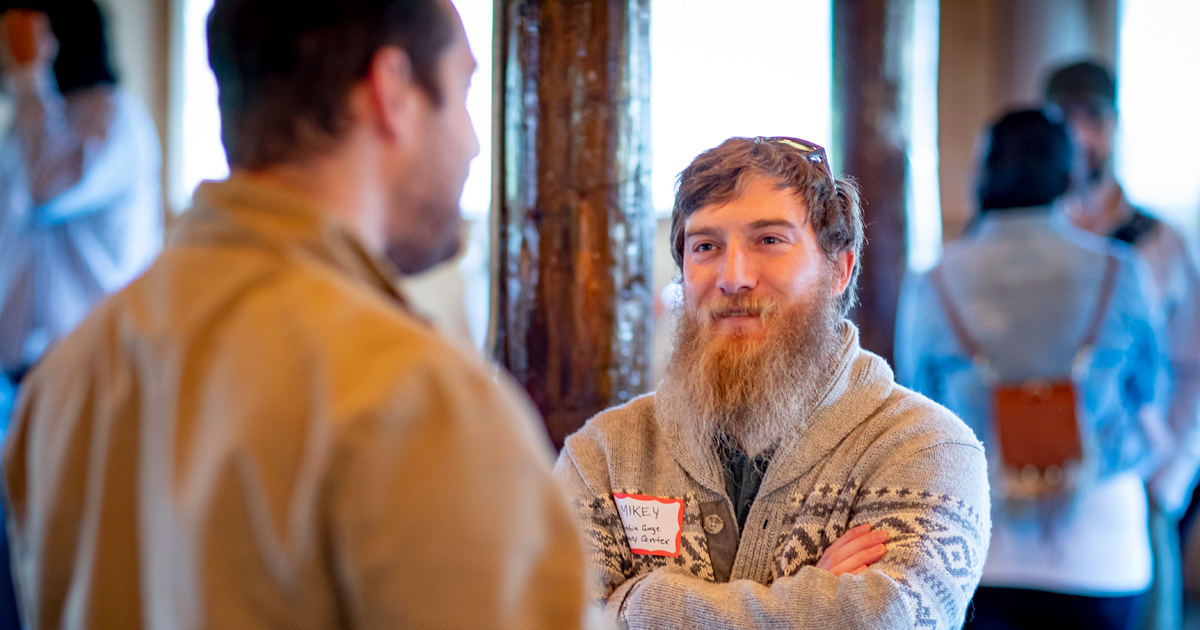 Men talking at a conference
