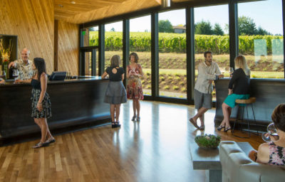 wine tasting in a clean, modern tasting room.