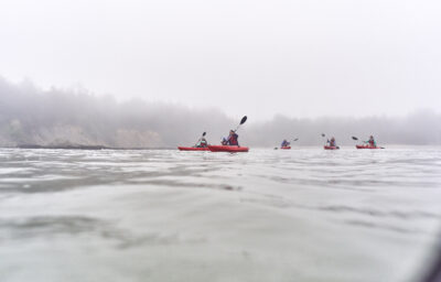 people kayaking on the oregon coast overcast