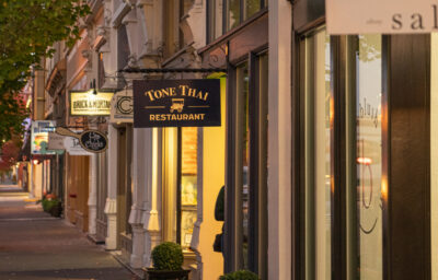 View of shops along main street at dusk.