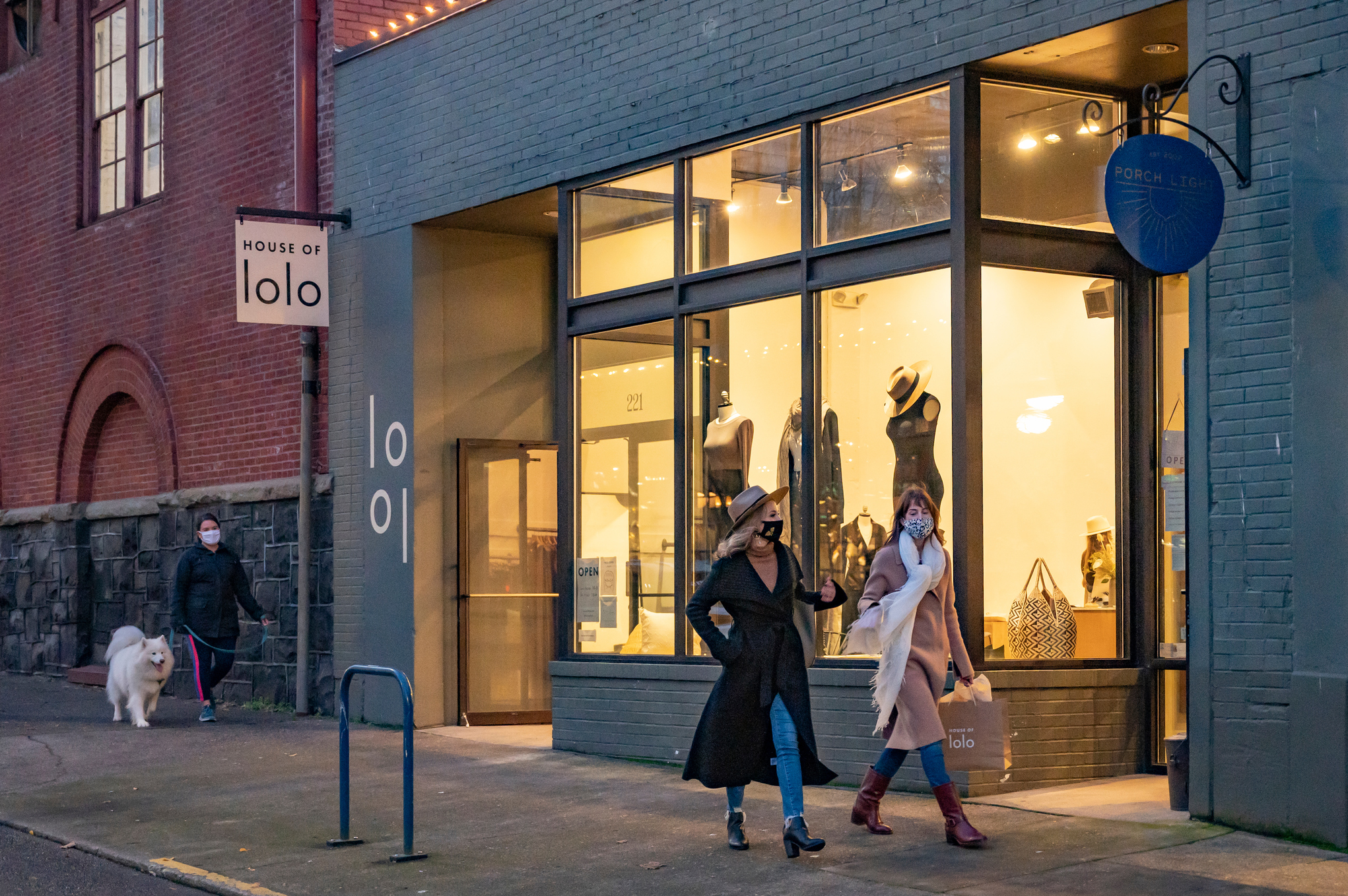 Two women wearing masks shopping downtown Portland.