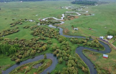 Winding creek through farmland in Klamath Falls.