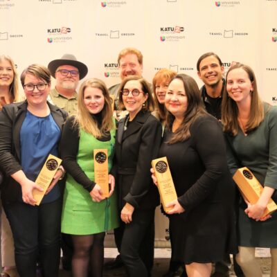 Group photo of travel and tourism awardees with Governor Kate Brown at the 2022 Governor's Conference on Tourism at Sunriver Resort.