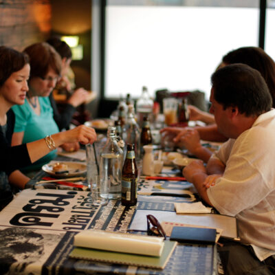 small seated group dines inside a restaurant