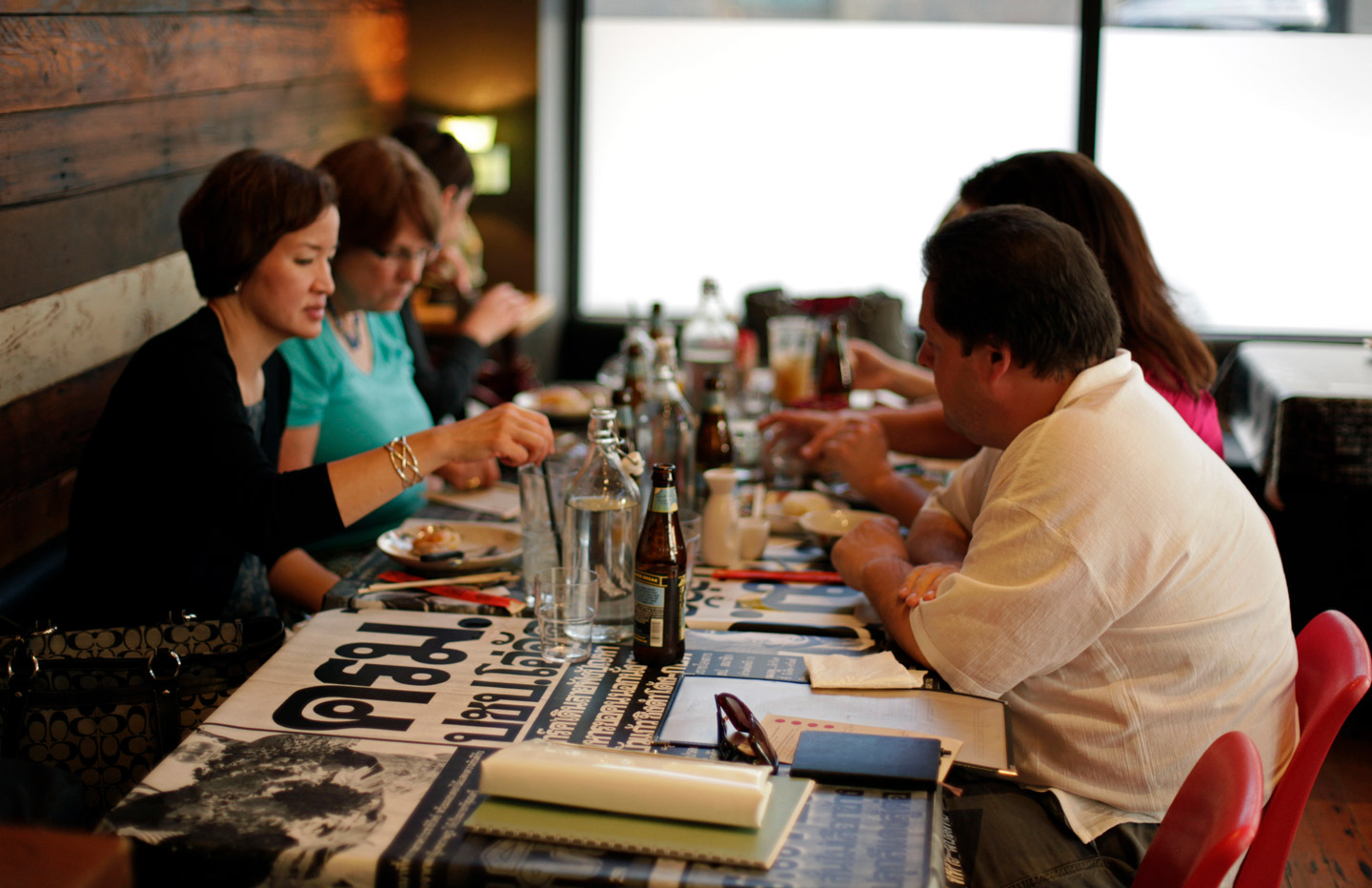 small seated group dines inside a restaurant
